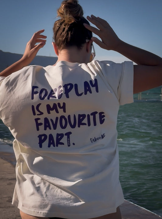 Person wearing a white t-shirt with text saying foreplay is my favourite part.